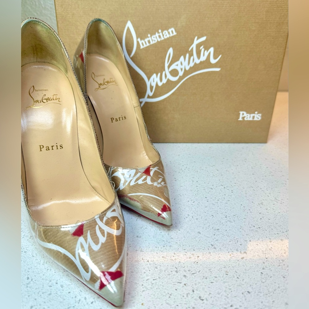 CHRISTIAN LOUBOUTIN 
PVC Loubi Print So Kate 100 Pumps 36.5 Kraft